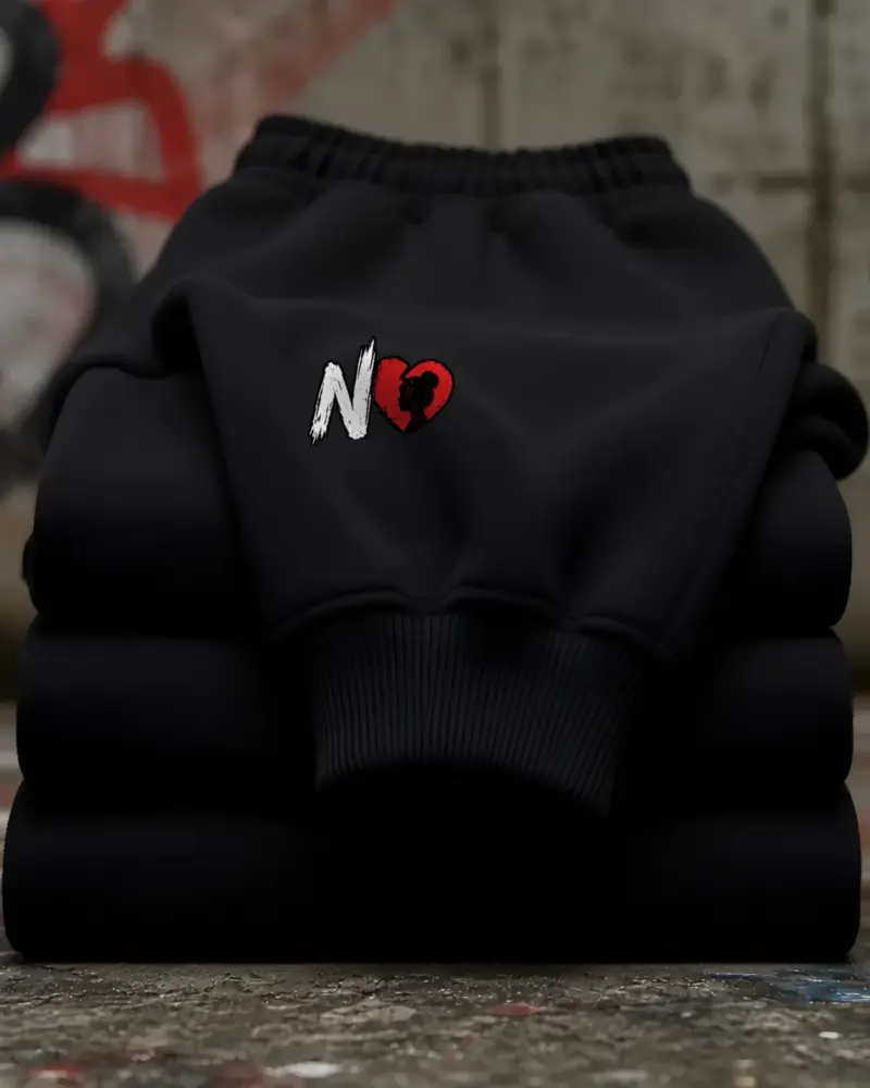 Concept mockup: black fleece sweatpants with N and broken heart mark on the upper thigh