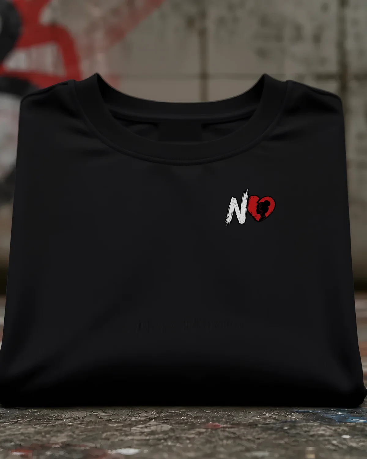 Concept mockup: black heavyweight tee with N and broken heart mark on the left chest